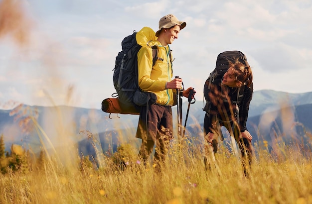 In adventure together Cute couple Majestic Carpathian Mountains Beautiful landscape of untouched nature