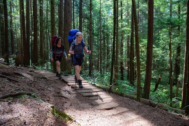 Adventurous friends are hiking Juan de Fuca Trail to Mystic Beach