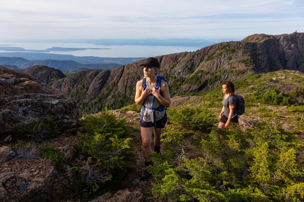 Adventurous girl hiking the trail in the Canadian Mountain Landscape