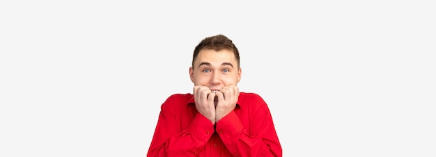 Advertisement background. Brand text. Surprised man in red shirt isolated on white empty space.