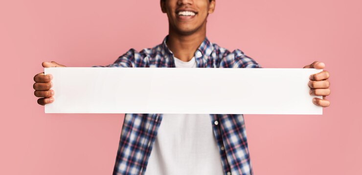 Photo advertisement concept guy holding blank banner for your text