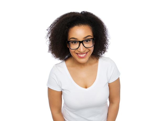 advertisement, education, ethnicity, vision and people concept - happy smiling young african woman or teenage student girl in eyeglasses and white t-shirt