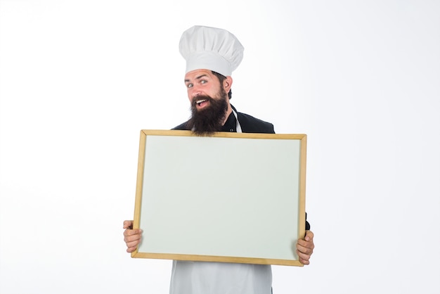 Advertising chef menu business lunch menu bearded chef holds blackboard restaurant chef show empty