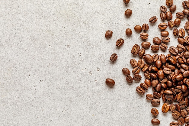 Advertising coffee poster stone background with scattered roasted beans