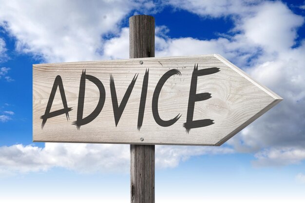 Advice wooden signpost with one arrow and cloudy sky in background