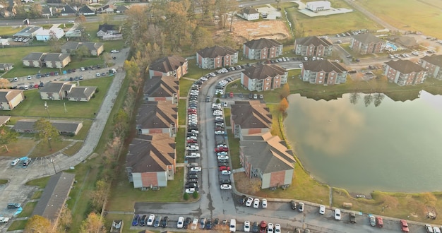 Aerial autumn scene the denham springs small town apartment complex near pond in louisiana us