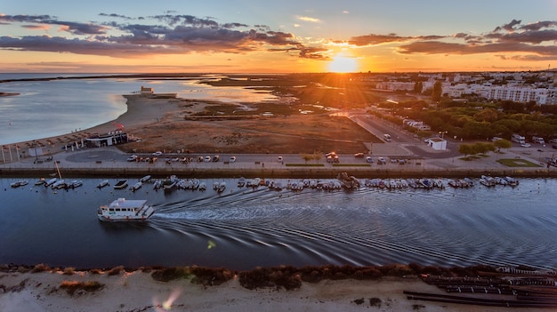 Photo aerial. beautiful sunset over the village of fuseta.