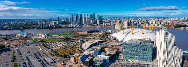 Aerial bird's eye view of the iconic O2 Arena near isle of Dogs and Emirates Air Line cable car in London, United Kingdom