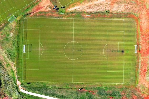 Aerial drone footage of a football field with another fields next to it
