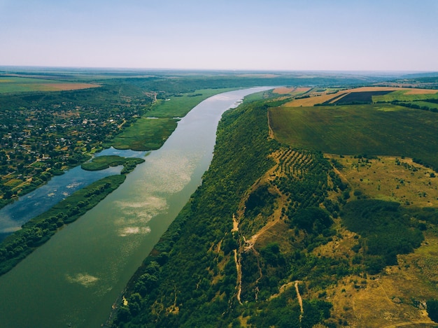 Aerial drone river and hills during summer in a sunny day.