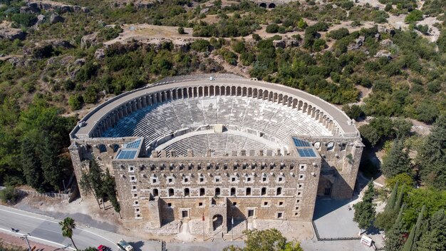 Aerial drone view of Aspendos Anthique Theater, best-preserved antique theater in the world, Antalya - Turkey