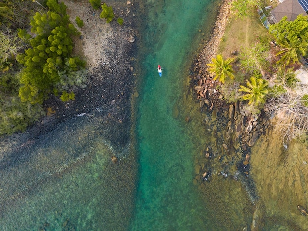 Aerial drone view of beautiful beach with turquoise sea water and palm trees of Gulf of Thailand Kood island Thailand