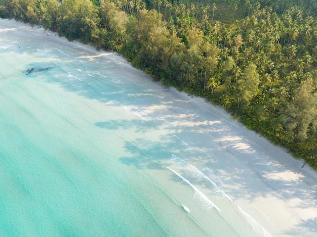 Aerial drone view of beautiful beach with turquoise sea water and palm trees of Gulf of Thailand Kood island Thailand