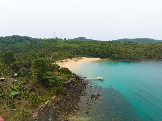 Aerial drone view of beautiful beach with turquoise sea water and palm trees of Gulf of Thailand Kood island Thailand