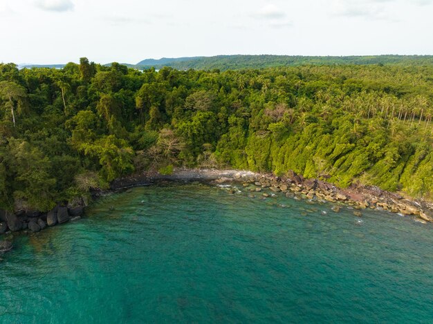 Aerial drone view of beautiful beach with turquoise sea water and palm trees of Gulf of Thailand