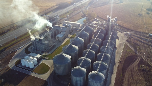 Aerial Drone View Flight Over complex of grain elevator buildings