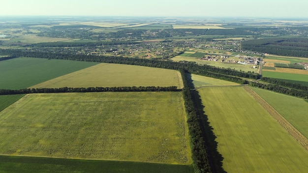 Aerial drone view flight over different agricultural fields