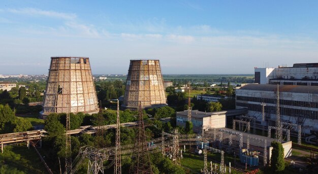 Photo aerial drone view flight near thermal power plant cooling towers of chp thermoelectric power station