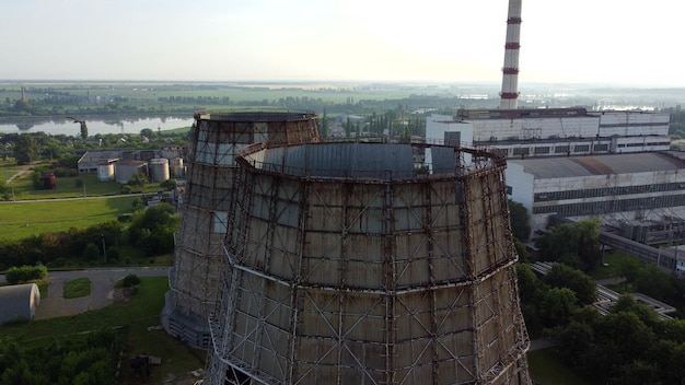 Aerial drone view flight near thermal power plant. Cooling towers of CHP
