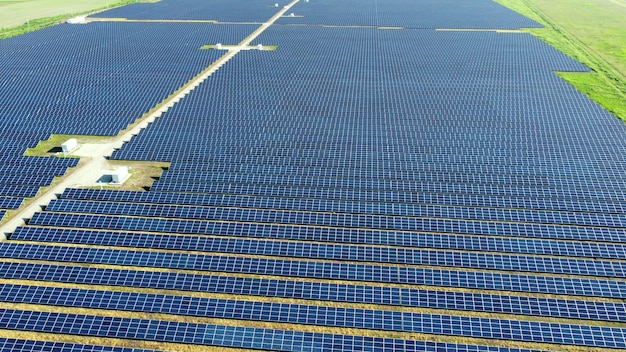 Aerial drone view flight over solar power station panels.