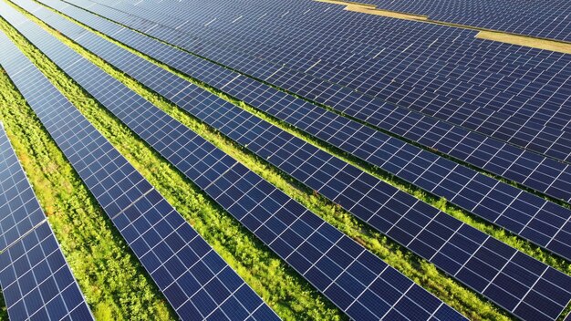 Aerial drone view flight over solar power station panels.