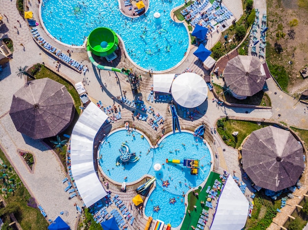 Aerial drone view looking straight down from above colorful summer time fun at water park