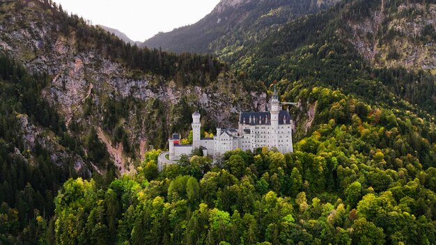 Aerial drone view Neuschwanstein castle on Alps Bavaria Germany Europe Autumn landscape