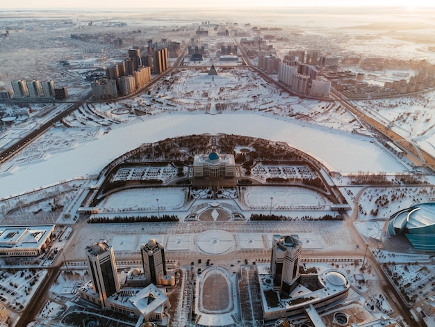 Aerial drone view NurSultan Kazakhstan Qazaqstan city center with skyscrapers and Baiterek Tower