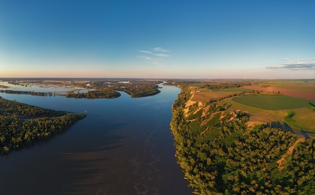 Photo aerial drone view of river landscape in sunny summer sunset top view of siberian ob river from high ...