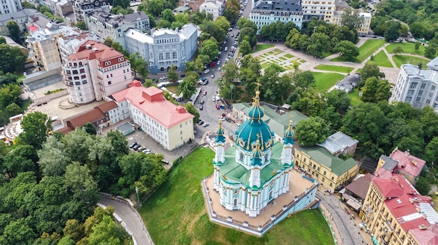 Aerial drone view of Saint Andrew's church and Andreevska street from above, cityscape of Podol district, city of Kiev (Kyiv), Ukraine