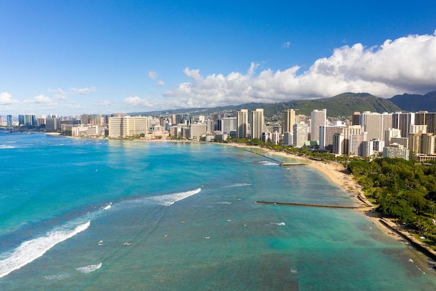 Aerial drone view of the sea front on Waikiki with Honolulu in the background