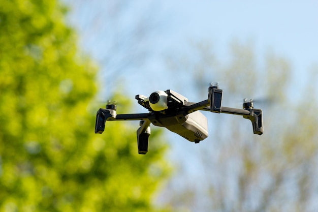 Aerial drone with mounted camera in the park photo and video concept