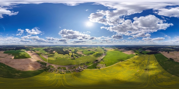 aerial full seamless spherical hdri 360 panorama view above green eco village with private development sector with country houses and barns in equirectangular projection