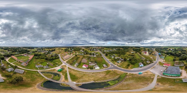 Aerial full seamless spherical hdri 360 panorama view above green village with private development sector with country houses in equirectangular projection use like sky replacement for drone shots