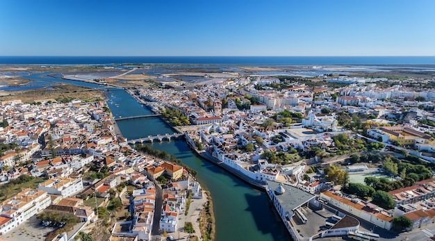 Aerial. The Gilao River and bridges in the city of Tavira.