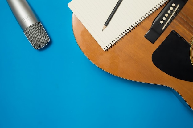 Aerial Guitar and Microphone on Color Background