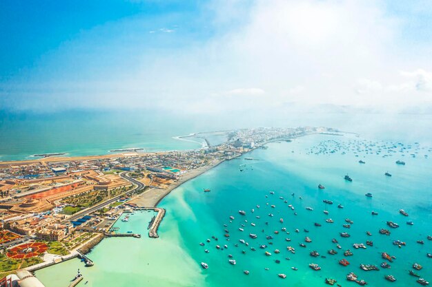 Aerial landscape of the island with fishing village around the island blue sky with clouds