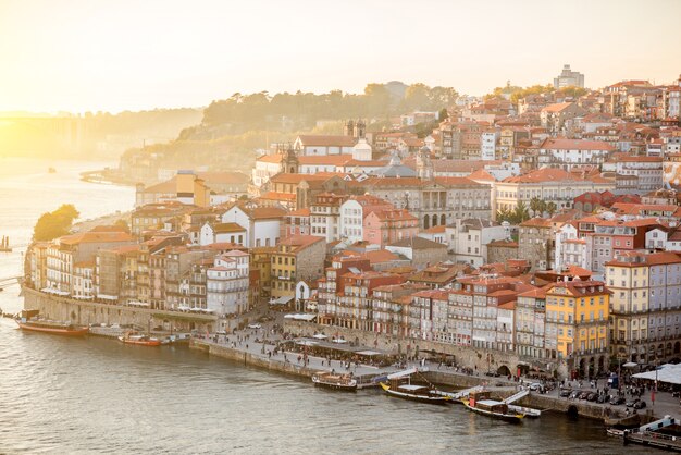 Aerial landscape view on the Douro river and old town of Porto during the sunset in Portugal