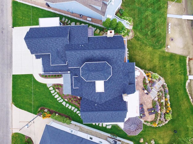 Aerial Looking Down on Luxury Suburban Home with Landscaped Garden