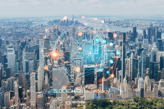 Aerial panoramic helicopter city view of Midtown Manhattan neighborhoods and Central Park New York USA Decentralized economy Blockchain cryptography and cryptocurrency concept hologram