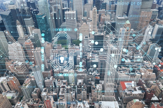 Aerial panoramic roof top city view of New York City Financial Downtown district at day time Manhattan NYC USA The concept of cyber security to protect confidential information padlock hologram