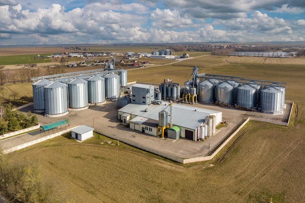 Aerial panoramic view on agroindustrial complex with silos and grain drying line