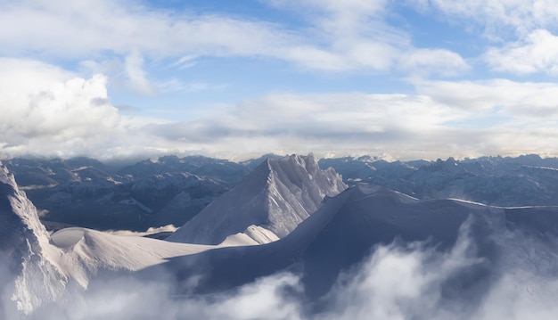 Aerial Panoramic View of Canadian Mountain covered in snow