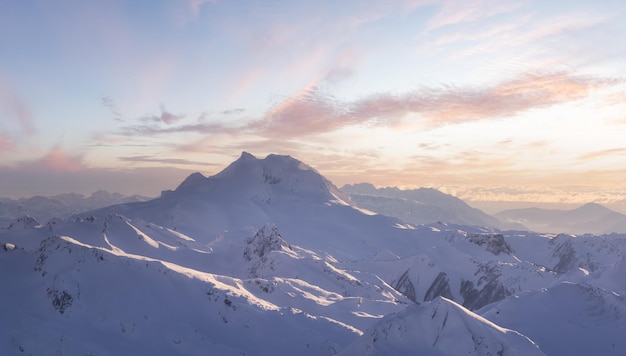 Aerial Panoramic View of Canadian Mountain covered in snow