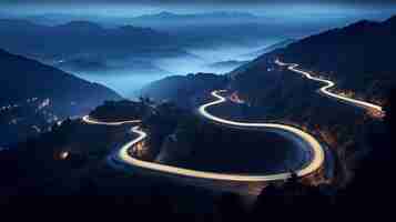 Photo aerial panoramic view of curvy mountain road with trailing lights at night