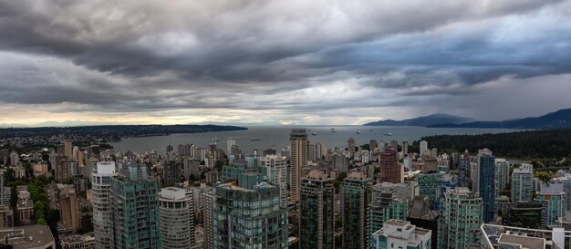 Aerial panoramic view of Downtown City during a stormy summer evening before sunset