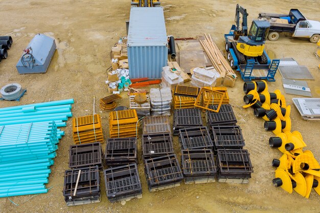 Aerial panoramic view at earthworks heavy equipment construction site for sewerge construction trench for laying external sewage drainage system