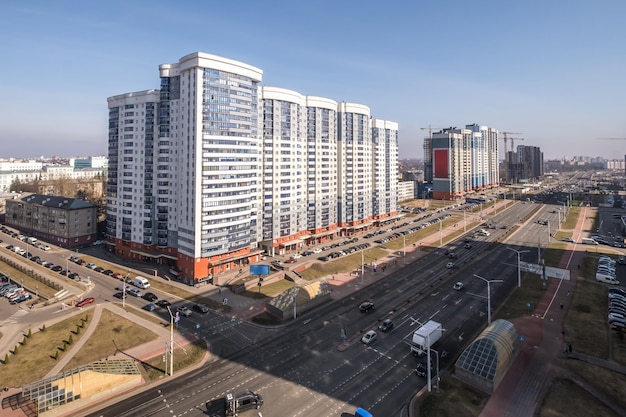 Aerial panoramic view from great height of city with a private sector and highrise urban apartment skyscraper buildings