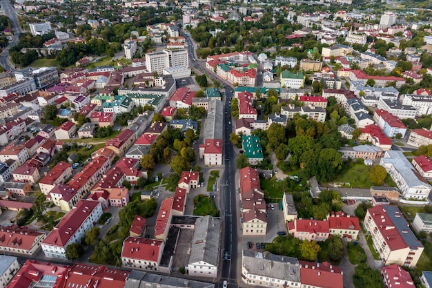 Aerial panoramic view from great height on red roofs of historical center of old big city