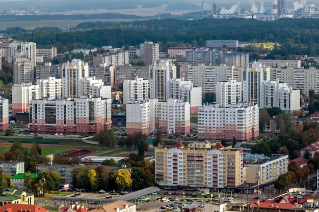 Aerial panoramic view from height of a multistorey residential complex and urban development in autumn day